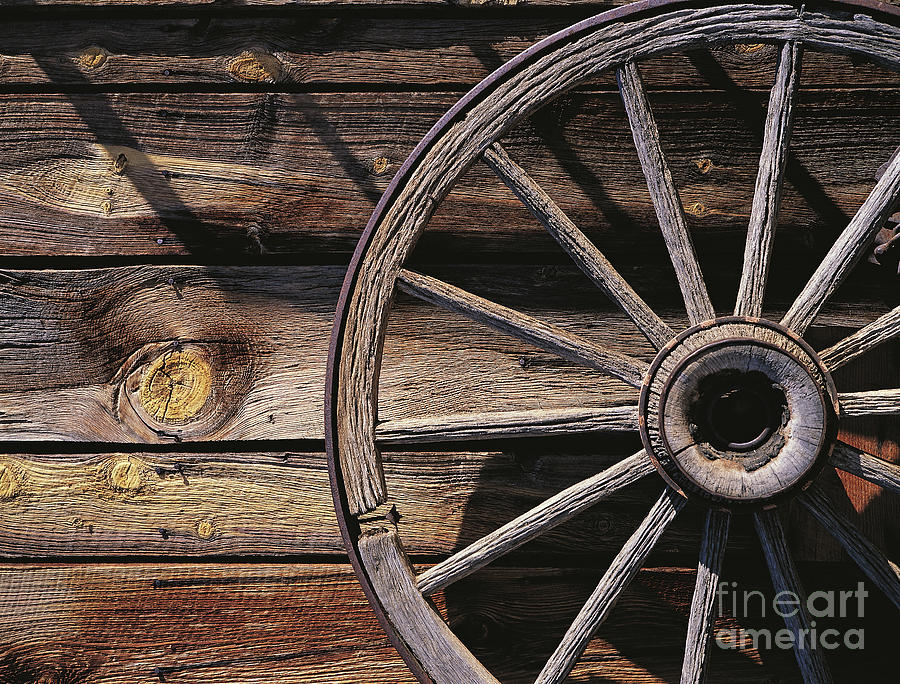 Old Wooden Cart And Wheel In A Ranch Photograph by Adam Sylvester