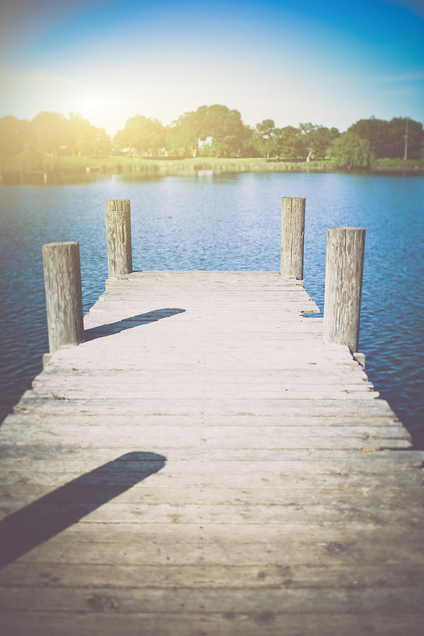 Old Wooden Deck With Lake In Background Photograph by Brandon Bourdages