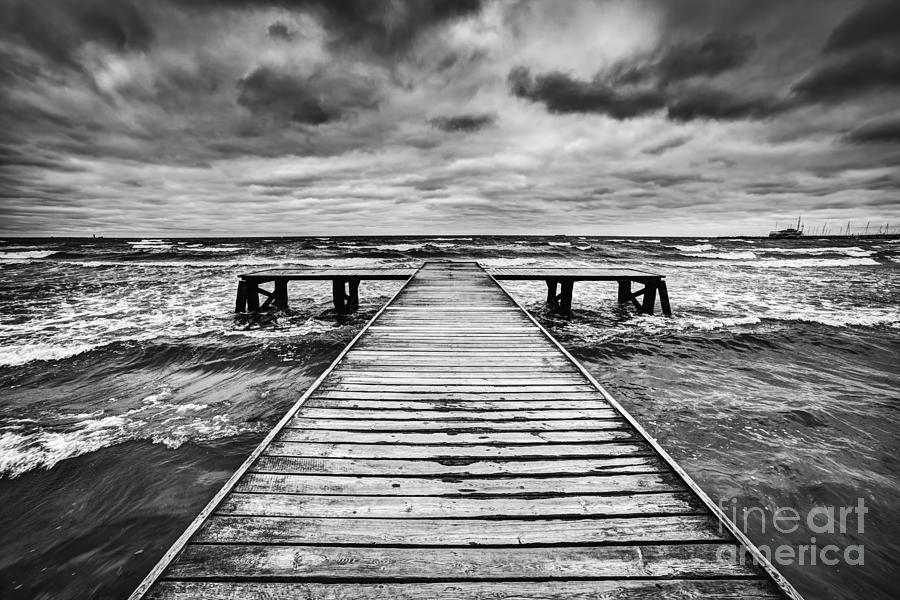 Old wooden jetty during storm on the sea Photograph by Michal Bednarek