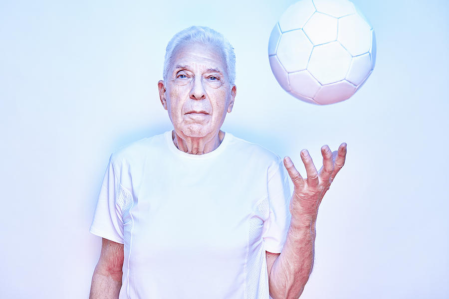 Older Man Throwing Up Ball Photograph by Tara Moore