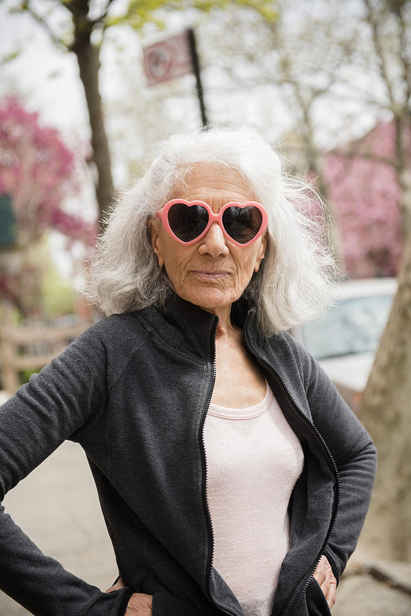 Older woman wearing heart-shape sunglasses Photograph by JGI/Jamie Grill