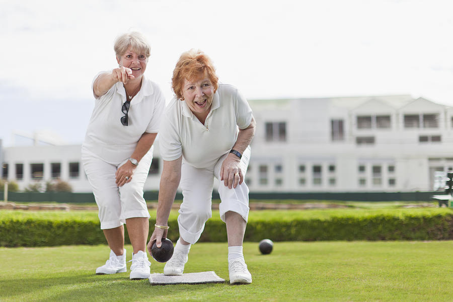 Older women playing lawn bowling Photograph by Photo_Concepts