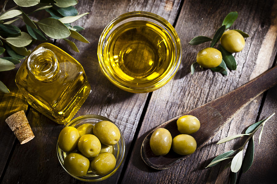 Olive oil and green olives shot from above Photograph by Fcafotodigital