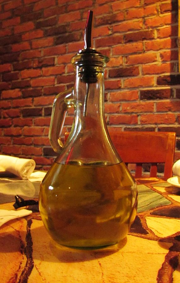 Olive Oil On Table Photograph by Cynthia Guinn