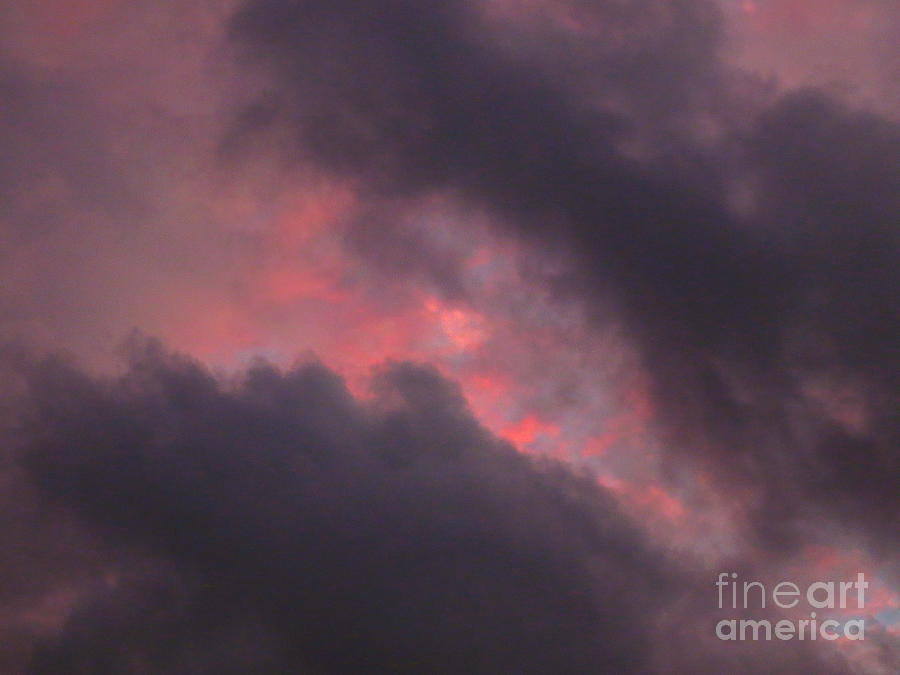 Ominous Clouds Surrounding A Beautiful Sunset Photograph by Robert Birkenes