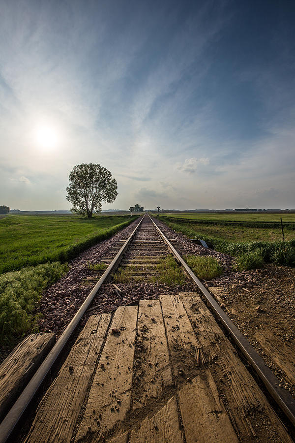 Sunset Photograph - On the right track by Aaron J Groen