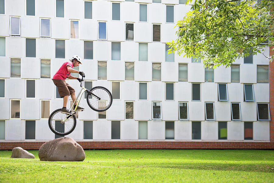 Architecture Photograph - One Man Riding His Bike At The Iteso by Marcos Ferro