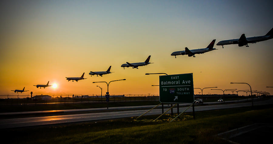 One Plane Landing at OHare Photograph by Anthony Doudt