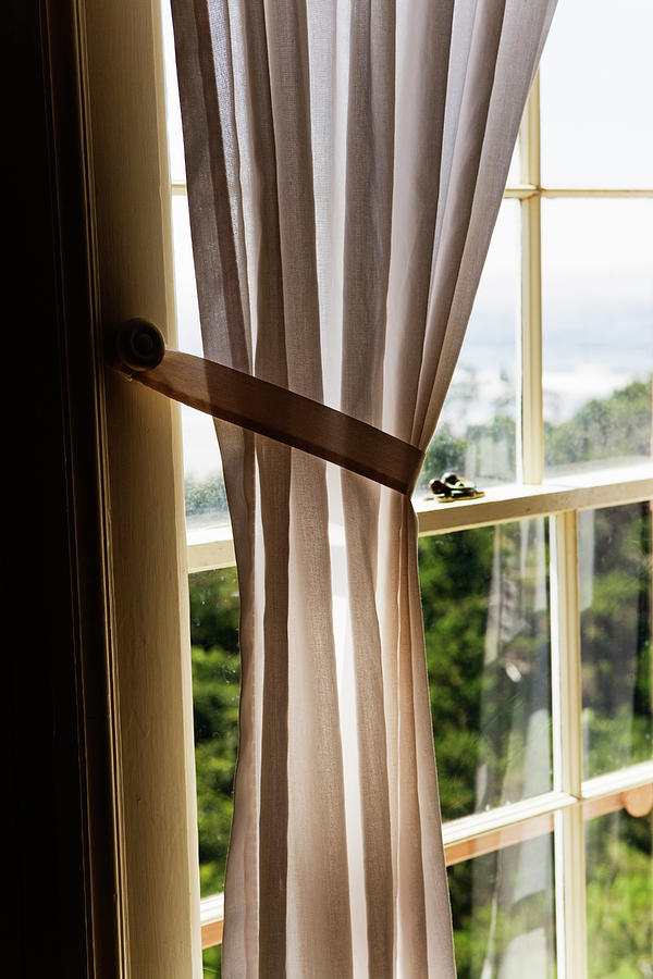 A Man Standing In Window Of Old House Photograph by Ron Koeberer