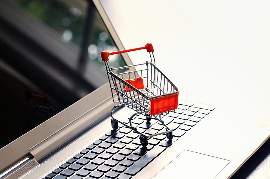 Online shopping with cart idea concept Photograph by Busakorn Pongparnit