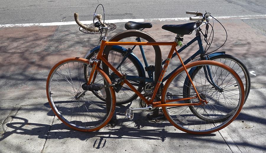 Orange and Blue Bikes Photograph by Joan Reese