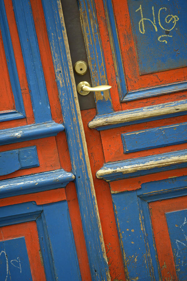 Orange and Blue Painted Wooden Door Photograph by Claudio Bacinello