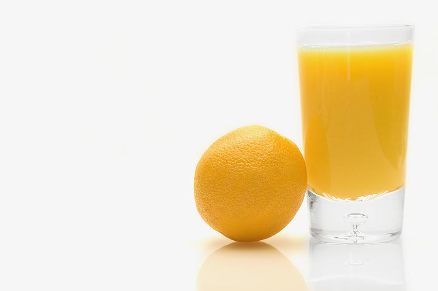 Fruit Photograph - Orange And Orange Juice by Darren Greenwood