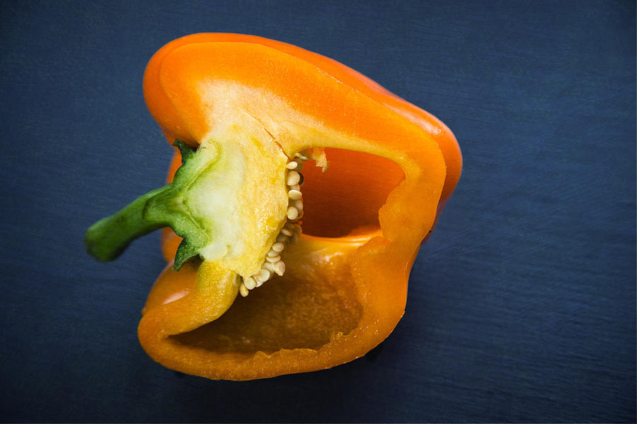 Orange bell pepper blue texture Photograph by Matthias Hauser