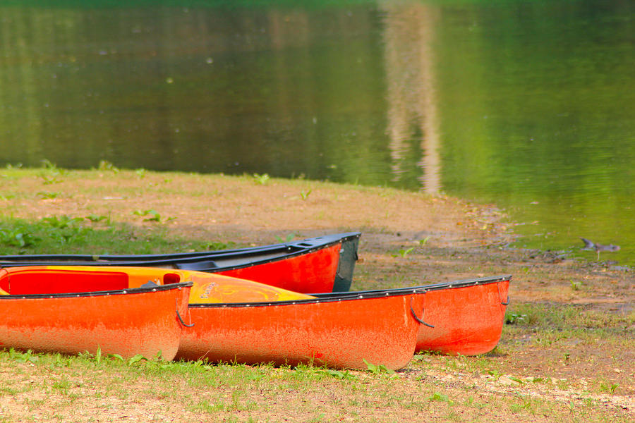 Ozarks Photograph - Orange Canoes by Karen Wagner