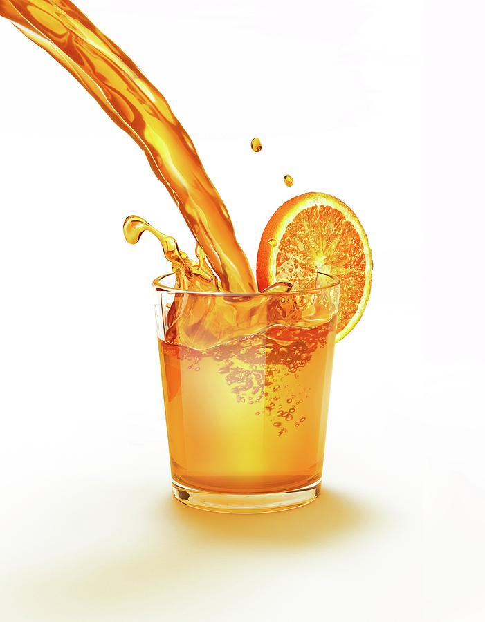 Cup Photograph - Orange Juice Being Poured Into A Glass by Leonello Calvetti