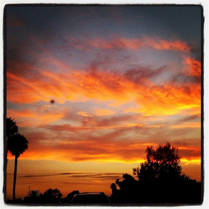 Orange Painted Clouds Photograph by Arya Acier - Fine Art America