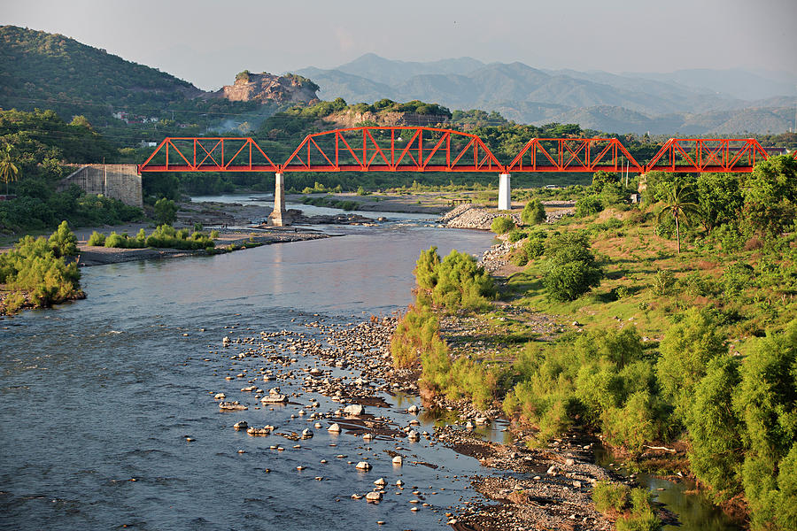 Orange Train Bridge Across River Photograph by Aaron Black