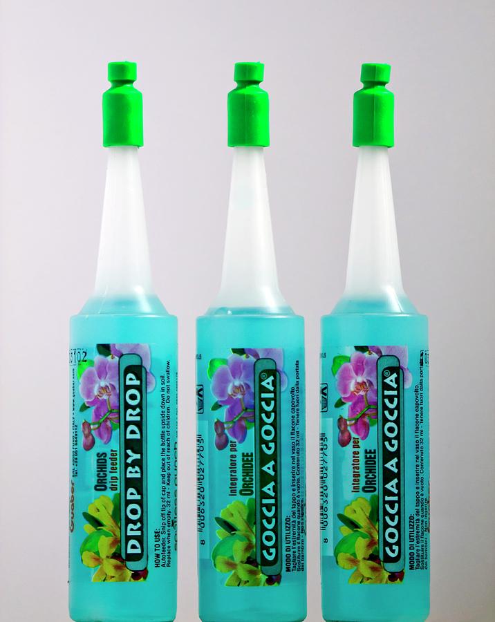 Orchid Liquid Feed Bottles Photograph By Ian Gowland Science Photo