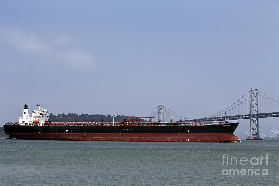 Orion Voyager Oil Tanker passing through Bay Bridge Photograph by Jason O Watson