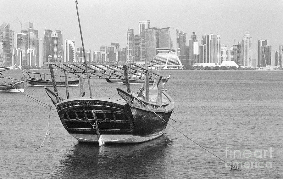 Ornate dhow and Doha towers Photograph by Paul Cowan