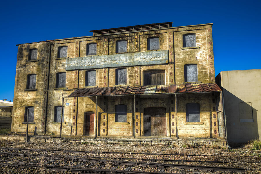 Architecture Photograph - Other Side Of The Tracks by Wayne Sherriff