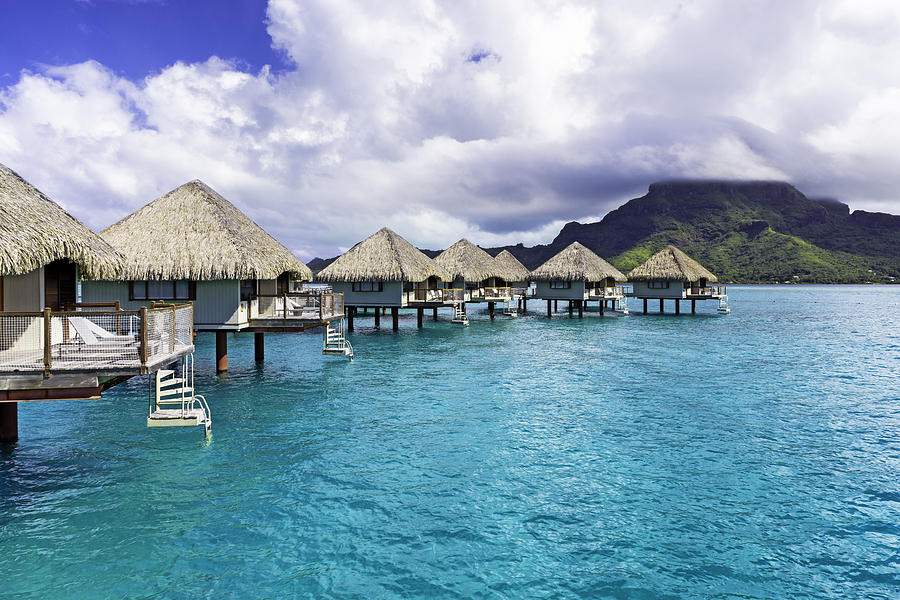 Overwater Bungalows on a Blue Lagoon in Bora Bora Photograph by Mel Ashar