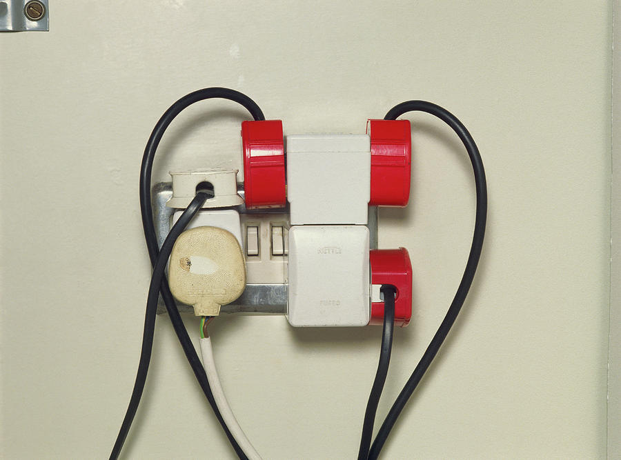 Overloading Of Plugs To An Electric Wall Socket Photograph by Garry Watson/science Photo Library