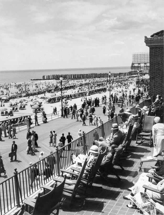 Black And White Photograph - Overlooking The Boardwalk by Underwood Archives