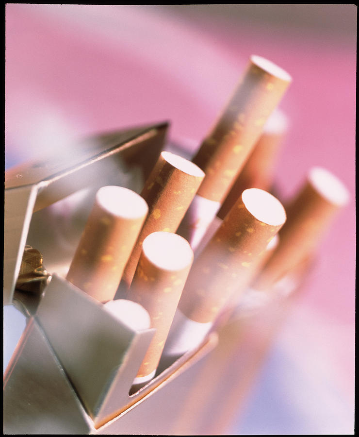 Packet Of Cigarettes Seen Through A Haze Of Smoke Photograph by Sheila Terry/science Photo Library