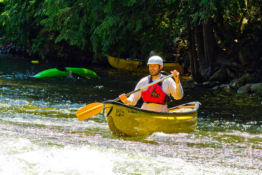 Paddler in a whitewater canoe Photograph by Les Palenik