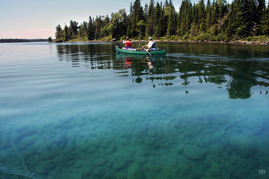 Paddling Clear Waters Photograph by John Meader