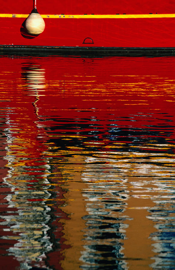 Painted Hull Of Boat Reflected In Photograph by David C Tomlinson