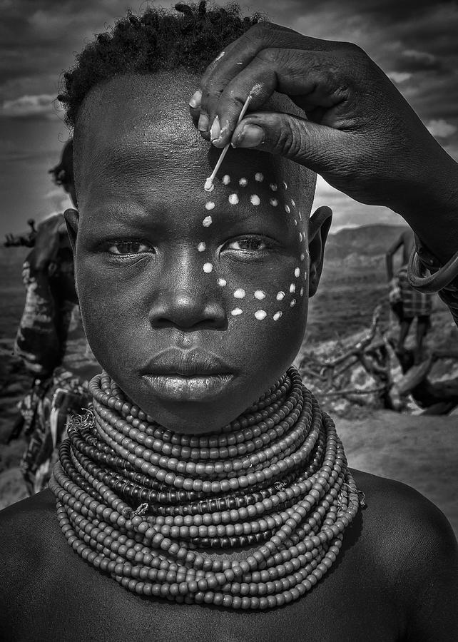 Black And White Photograph - Painting The Face Of A Karo Tribe Girl (omo Valley-ethiopia) by Joxe Inazio Kuesta