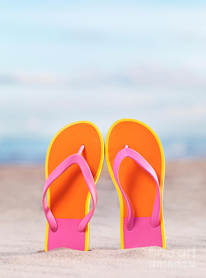 Pair of bright orange flip flops at the beach Photograph by Maxim Images Exquisite Prints