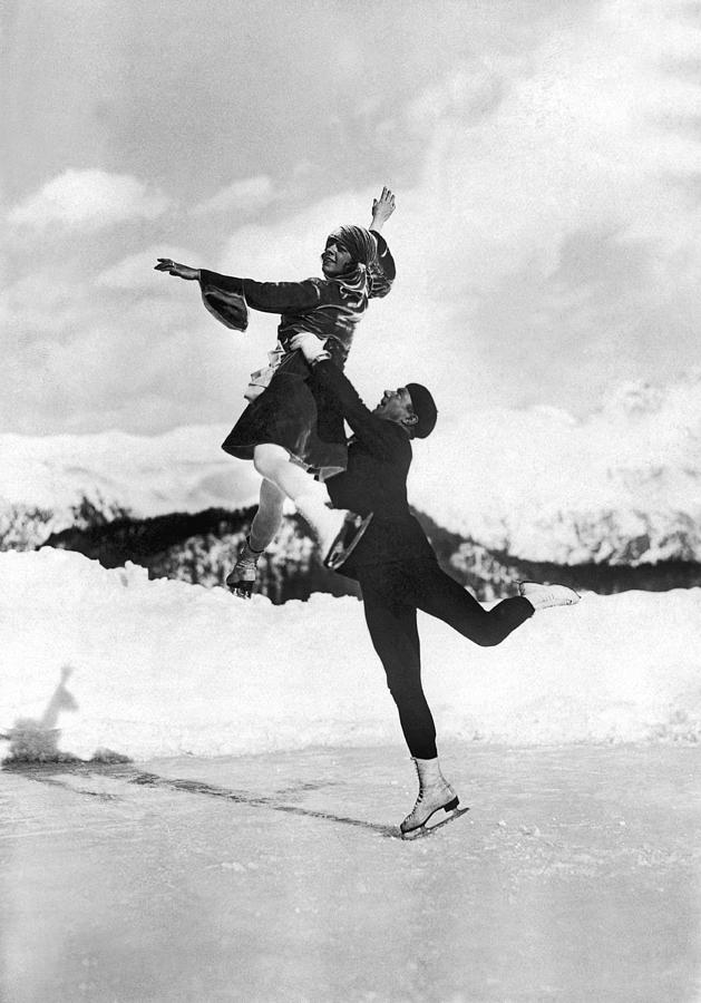 Athlete Photograph - Pairs Skaters Doing A Lift by Underwood Archives