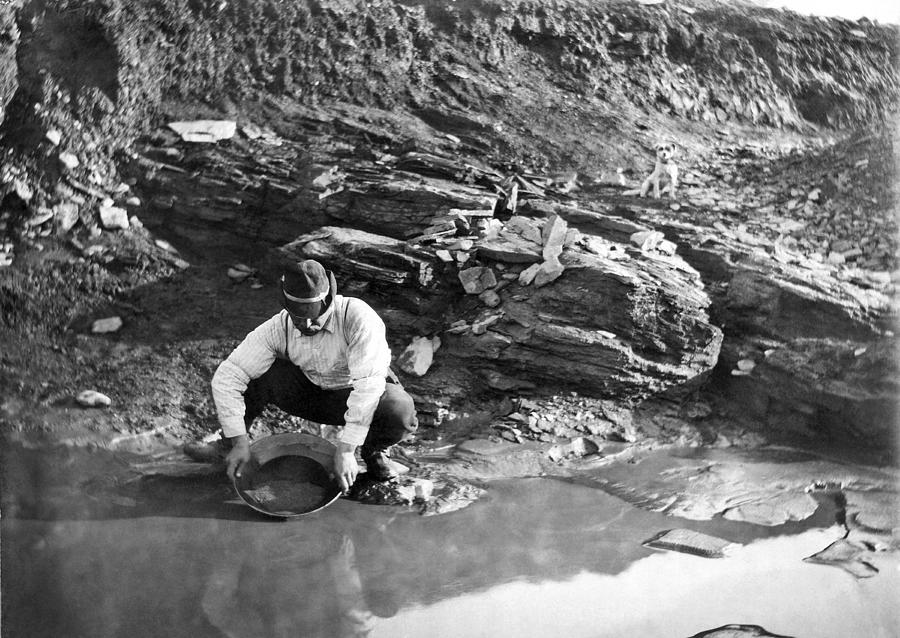 Black And White Photograph - Panning For Gold In Alaska by Underwood Archives