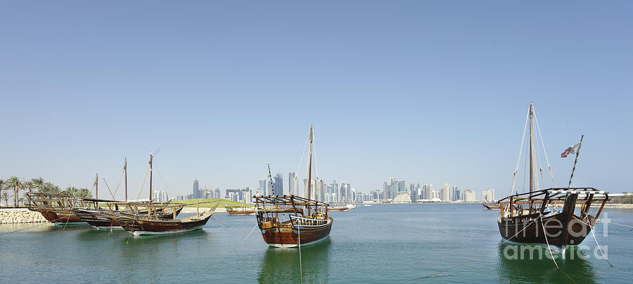 Panoramic dhows and Qatar skyline Photograph by Paul Cowan