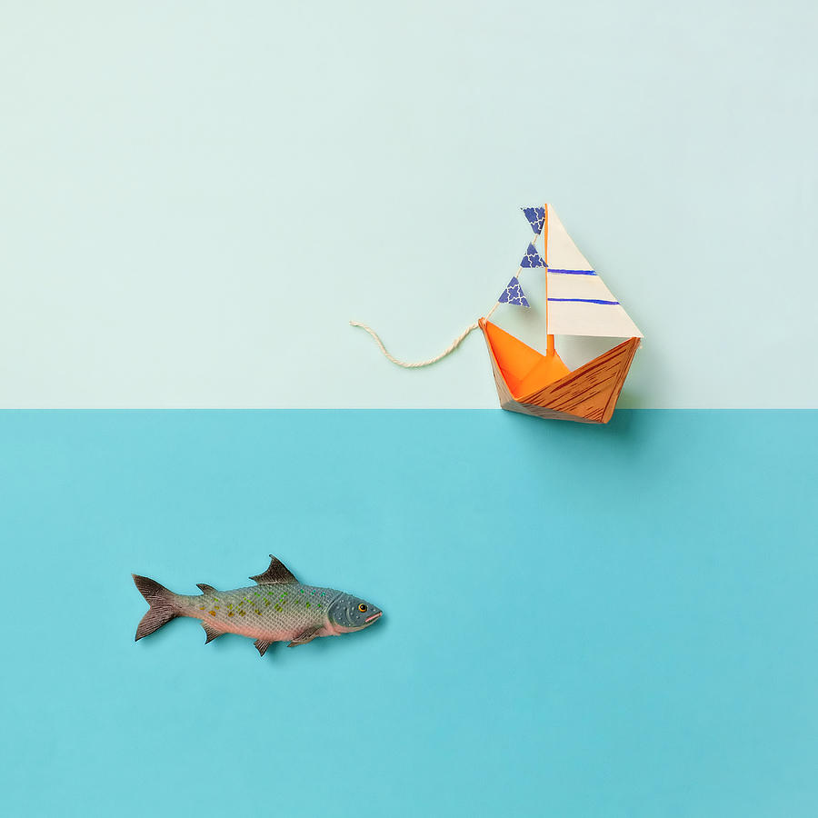 Paper Boat And Toy Fish Photograph by Juj Winn
