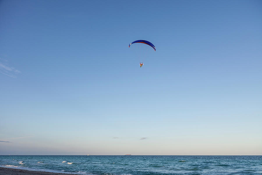 Paraglider Flying Over The Beach Photograph by Juan Silva