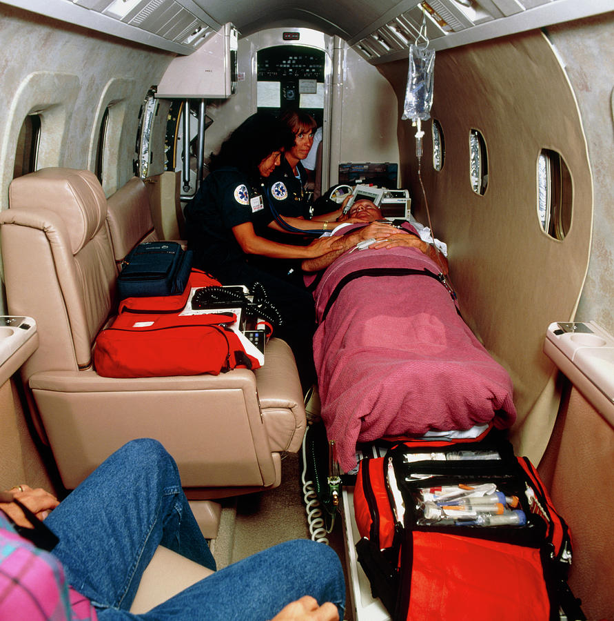 paramedics-with-a-patient-inside-an-air-ambulance-photograph-by-ed