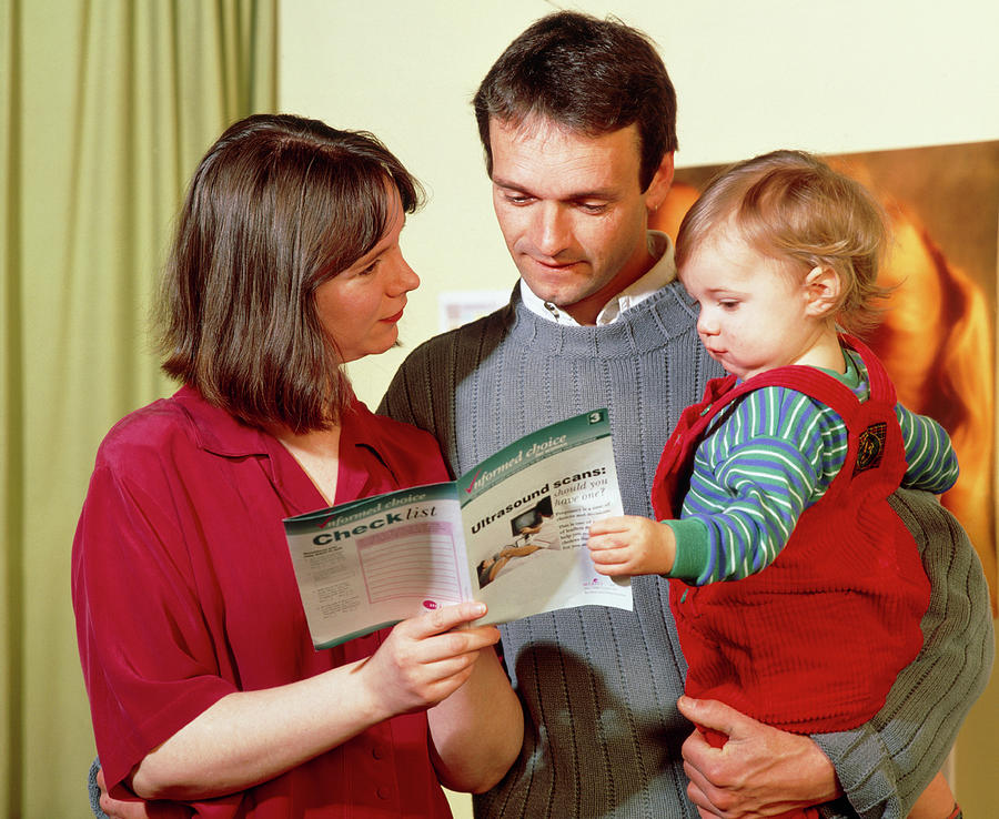 Parents With Their Child At A Doctors Surgery Photograph by Ruth Jenkinson/midirs/science Photo Library