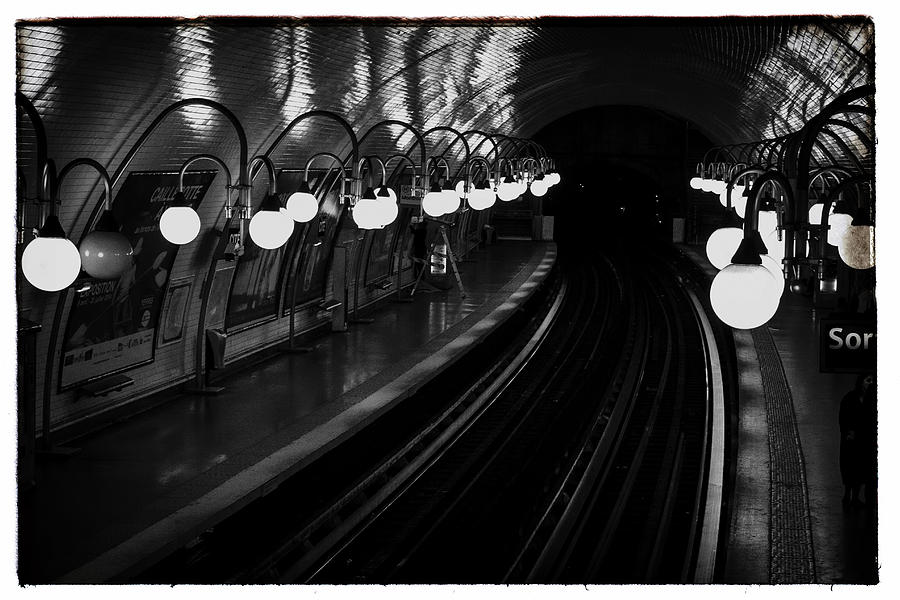 Paris Cite Underground in black and white Photograph by Georgia Clare