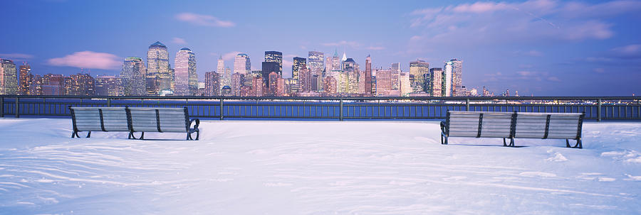 Park Benches In Snow With A City Photograph by Panoramic Images