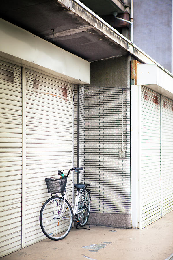 Parked Bicycle At Closed Business Photograph by Hal Bergman