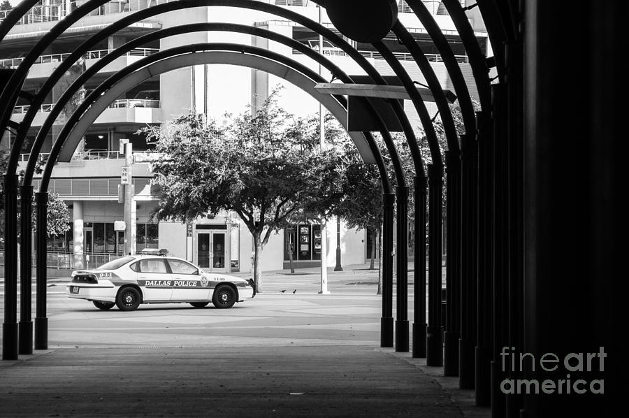 Parked Dallas Police Car with arched walkway Photograph by Imagery by Charly