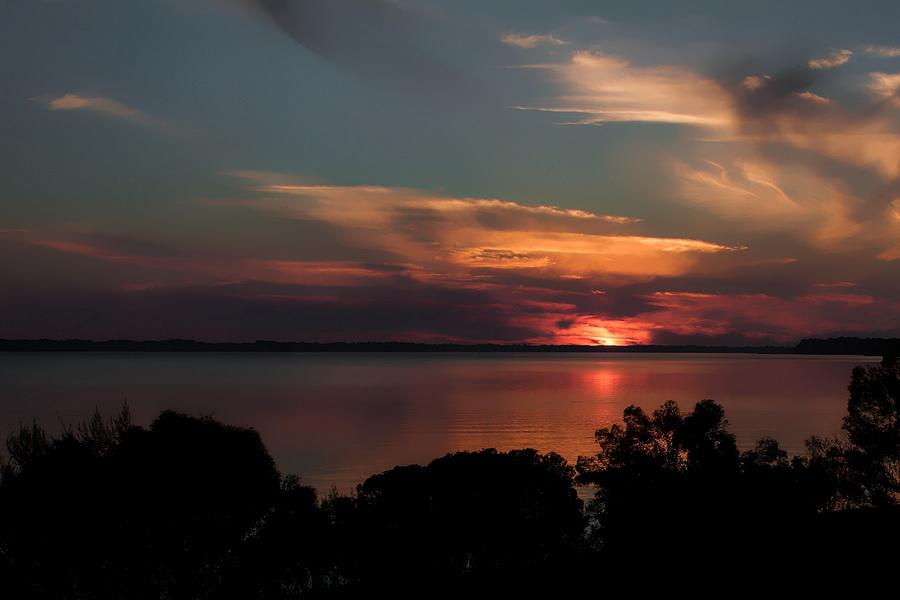 Partial Eclipse Sunset Photograph by Debra Forand