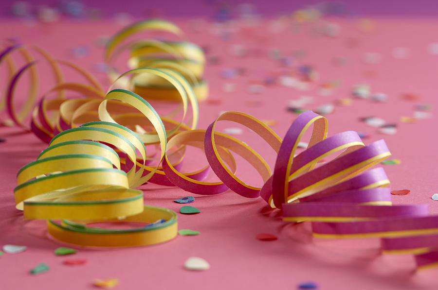 Party streamers, close-up Photograph by Achim Sass