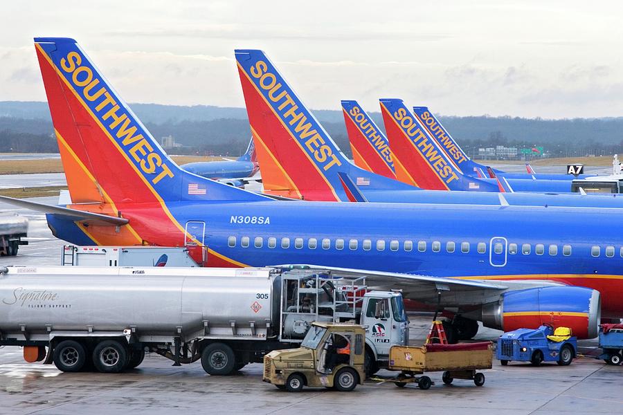 Passenger Jet Airliners At Airport Photograph by Jim West
