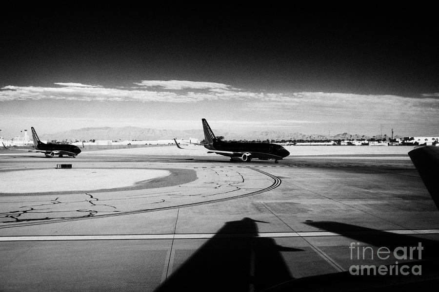 Las Vegas Photograph - passenger jets waiting in line to take off at McCarran International airport Las Vegas Nevada USA by Joe Fox